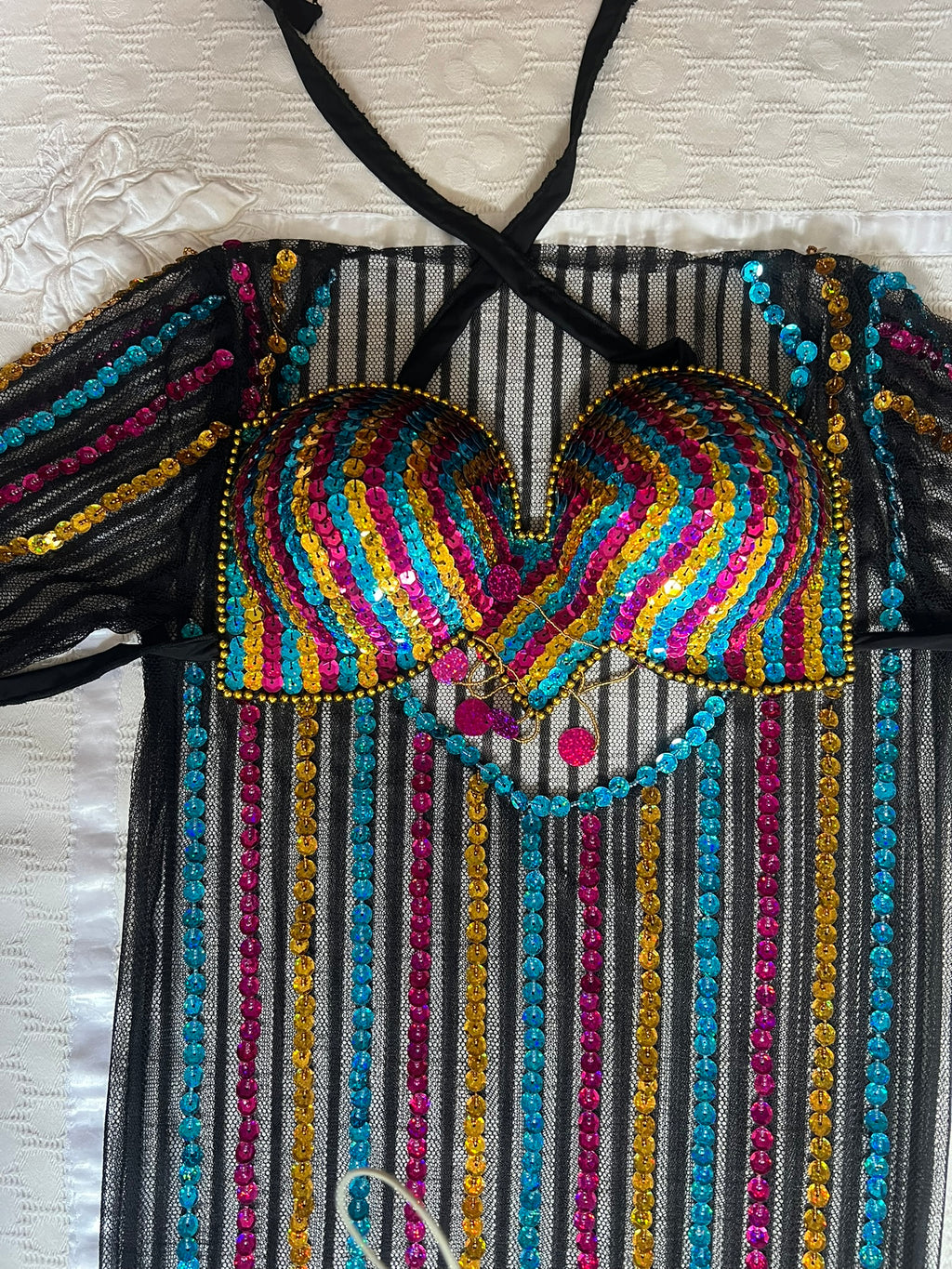 Colorful beaded top with black mesh background