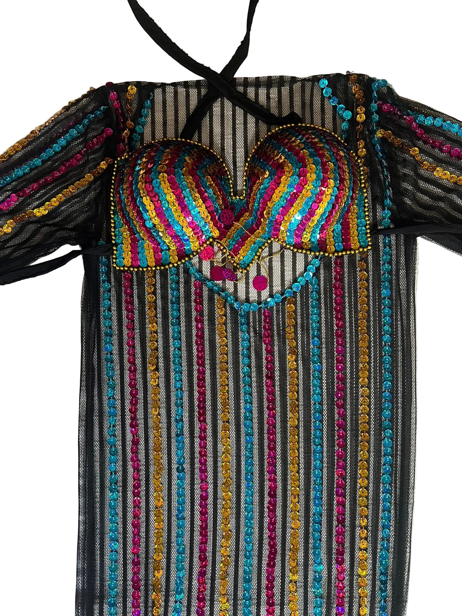 Colorful beaded top with striped pattern on a light wooden surface