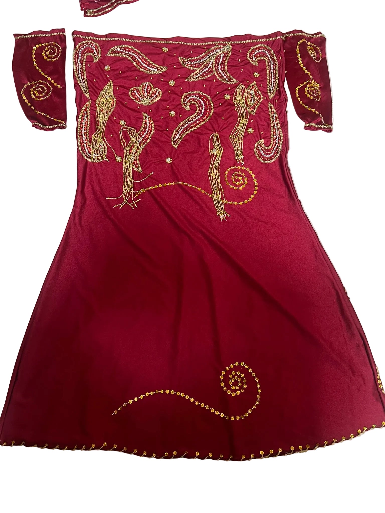 Red Belly dance dress with gold embroidery on a white surface