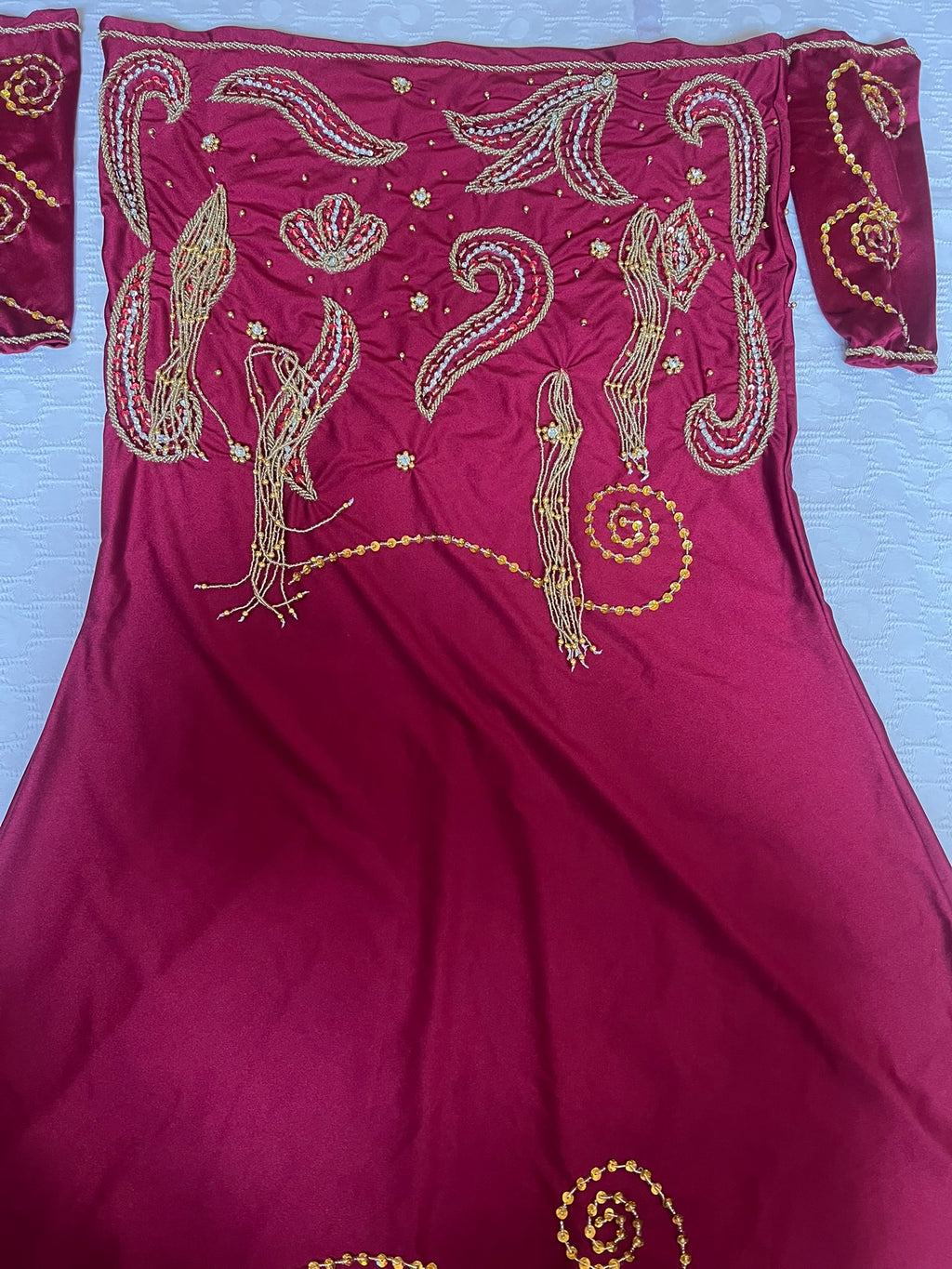 Red Belly dance skirt with gold embroidery on a white background