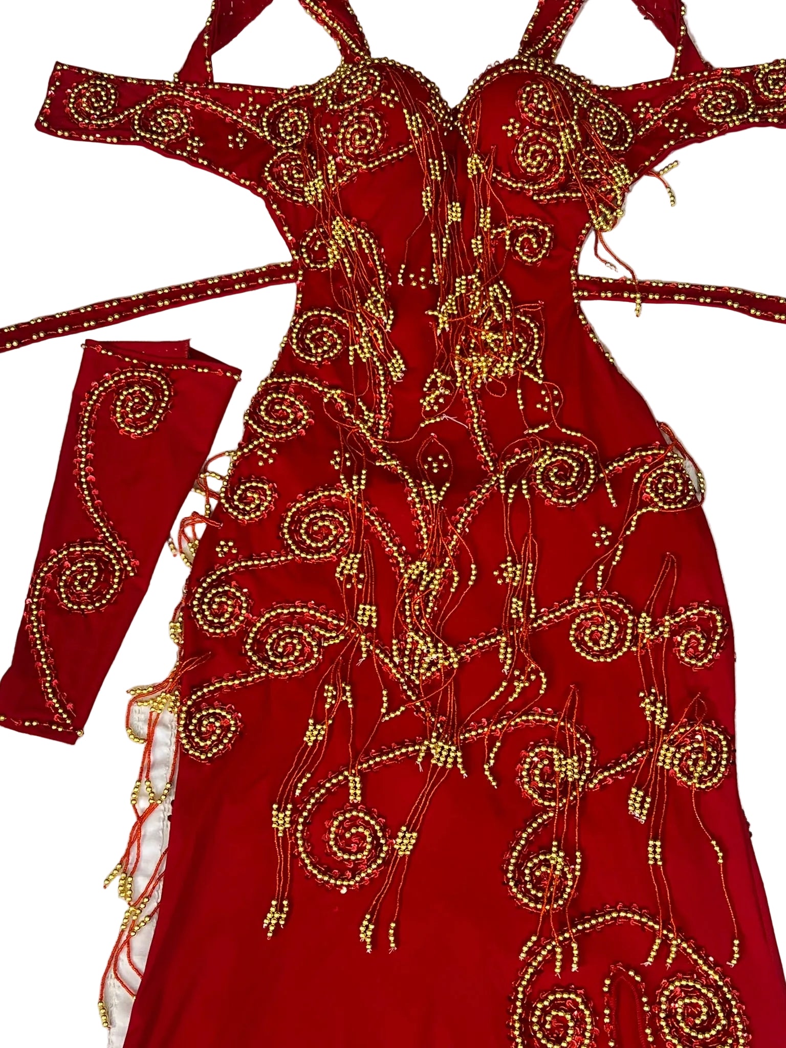 Red embroidered garment with gold details on a white background