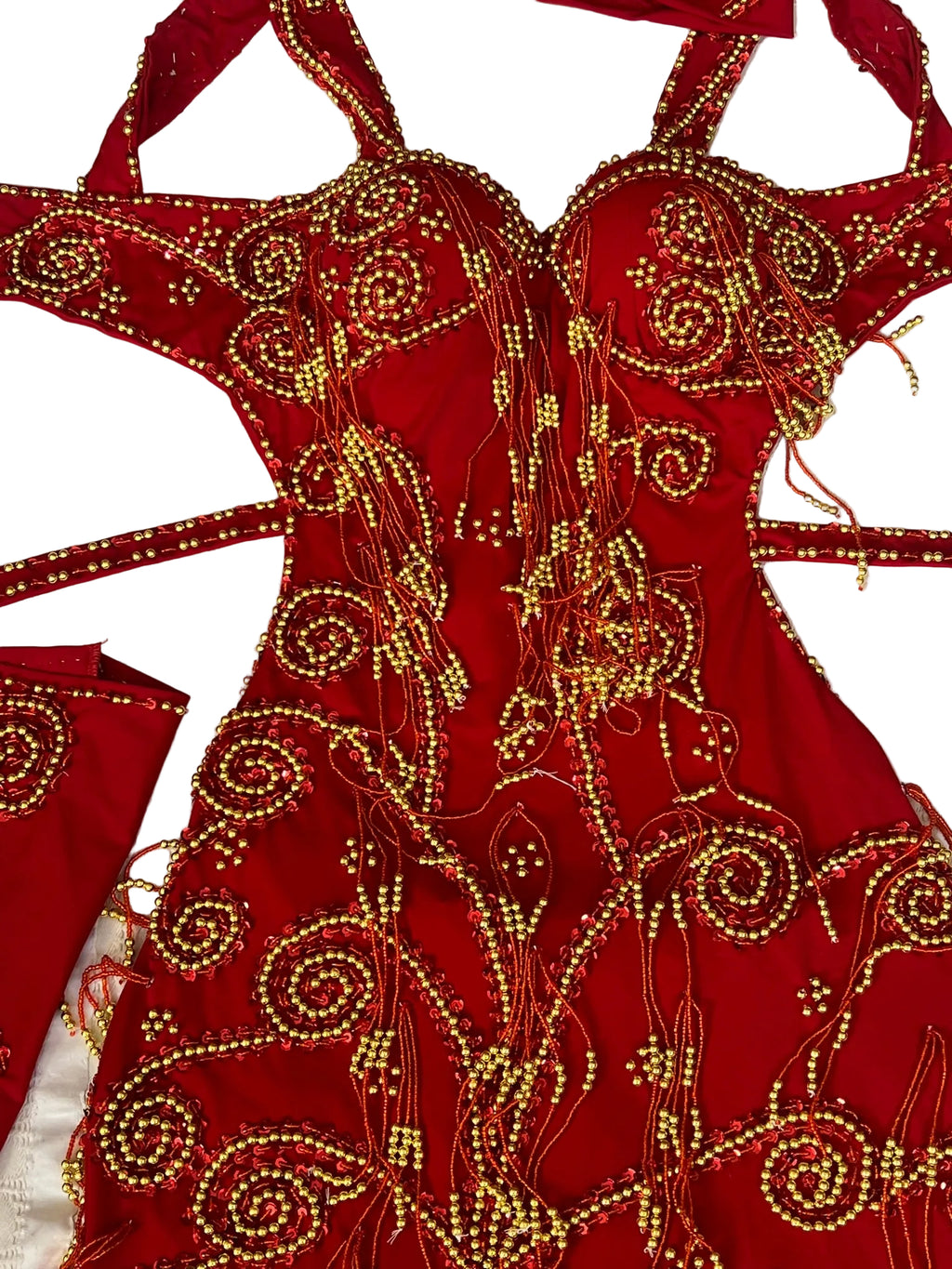 Red garment with gold embroidery on a white background