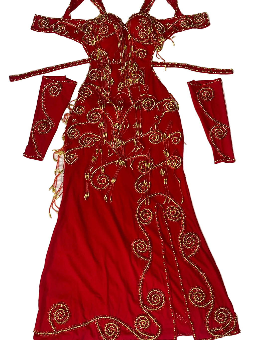 Red embroidered dress with gold patterns on a white background