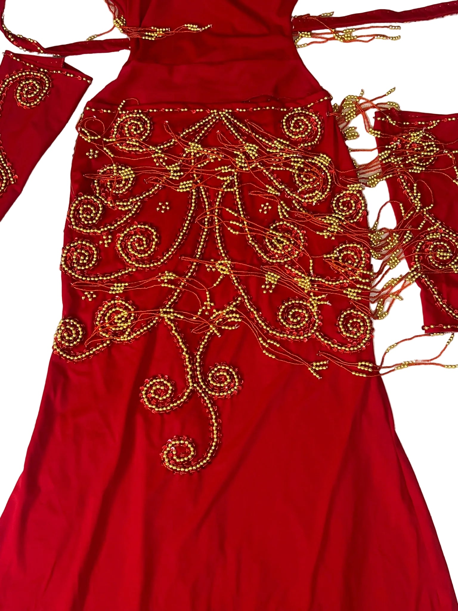 Red garment with gold embroidery on a white background