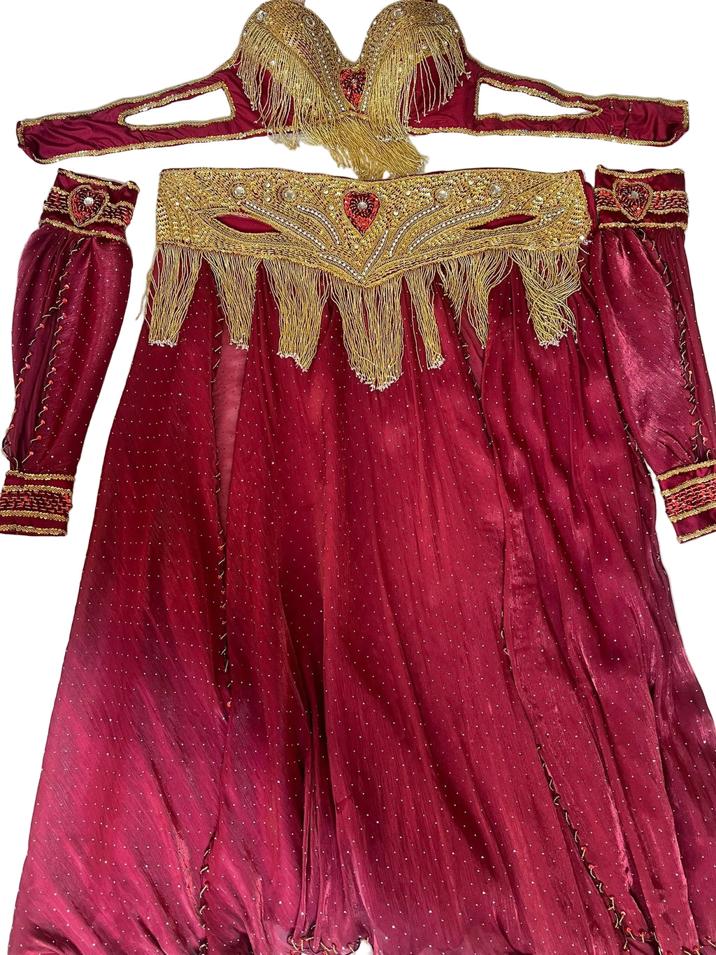 Red Belly dance outfit with gold embroidery and fringes on a white background