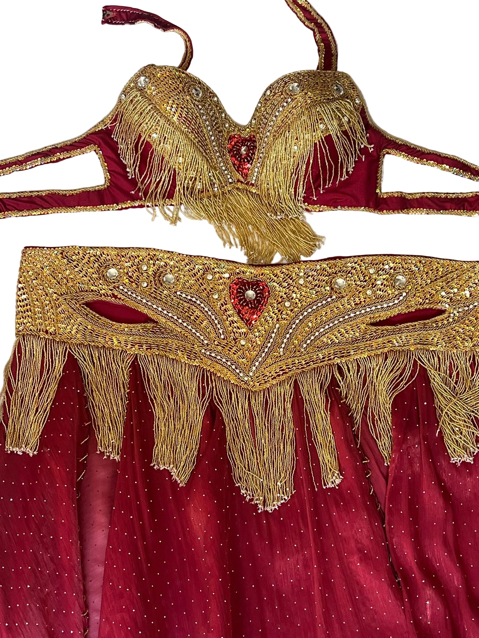 Red and gold embroidered costume with fringes on a white background