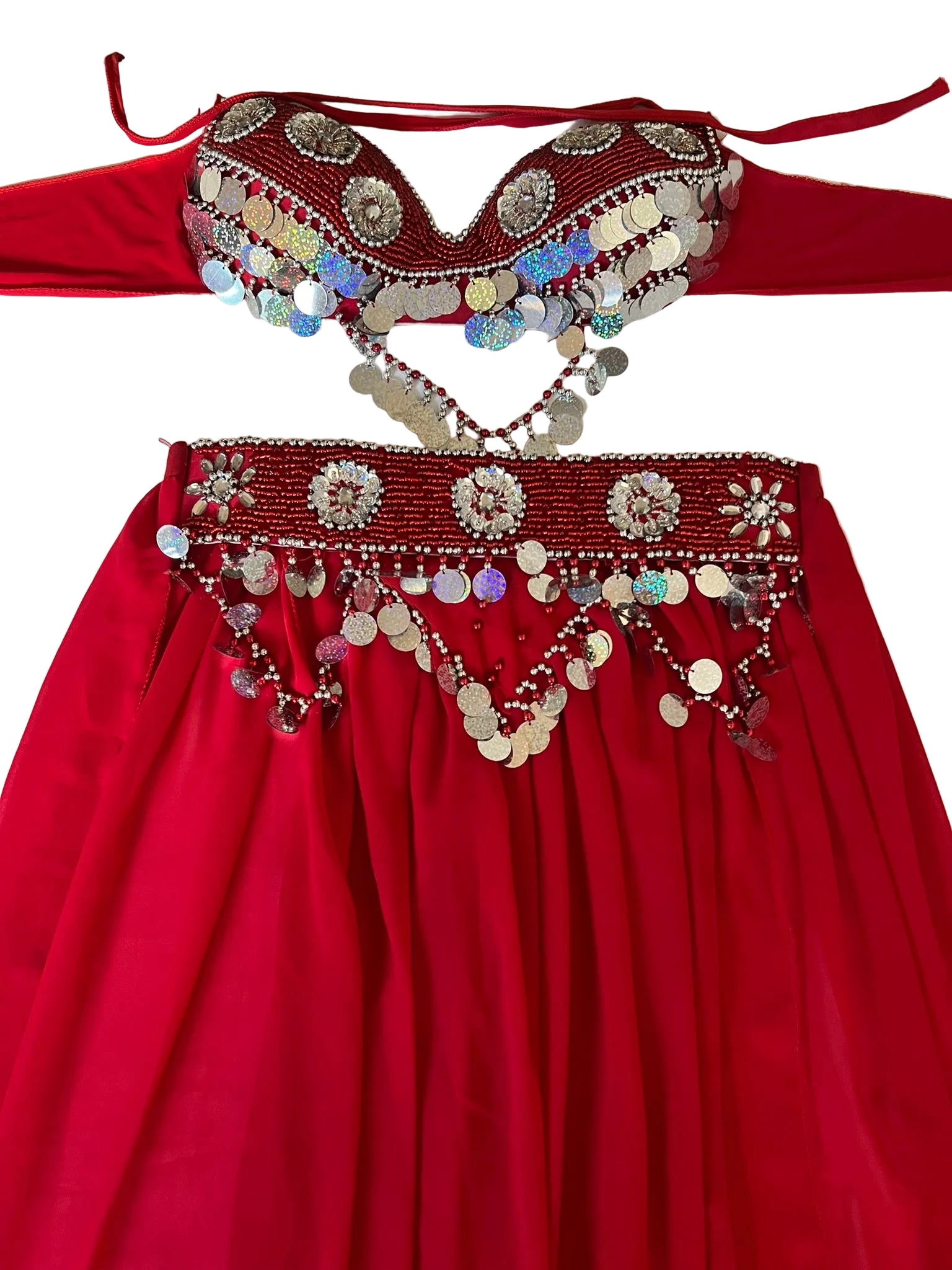 A red belly dance costume with a skirt, belt, and bra, adorned with handmade embroidery and beadwork.