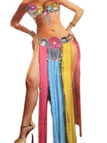 Colorful belly dancing costume with sequins and long flowing fabric on a neutral background.