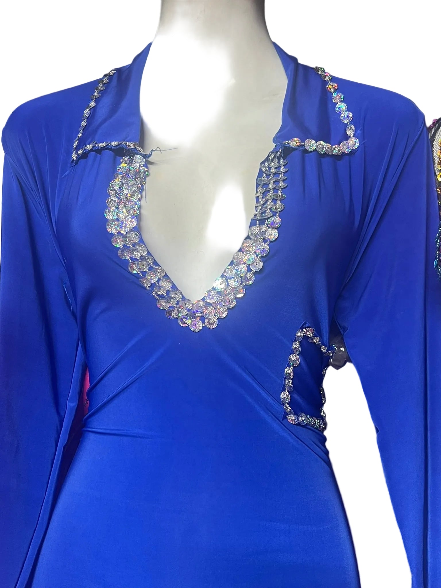 Blue dress with embellishments on a mannequin