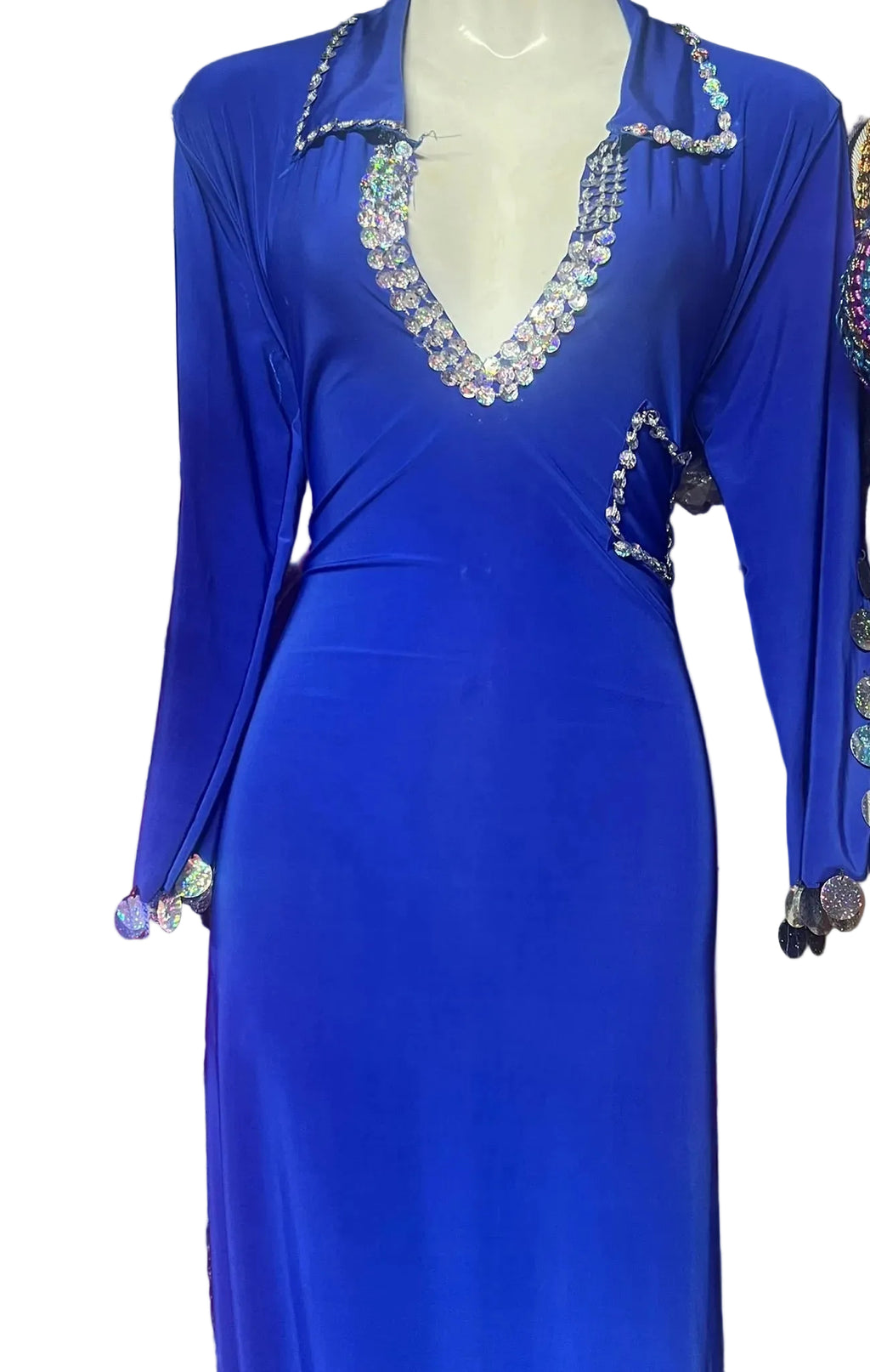 Blue dress with embellishments on a mannequin against a colorful background
