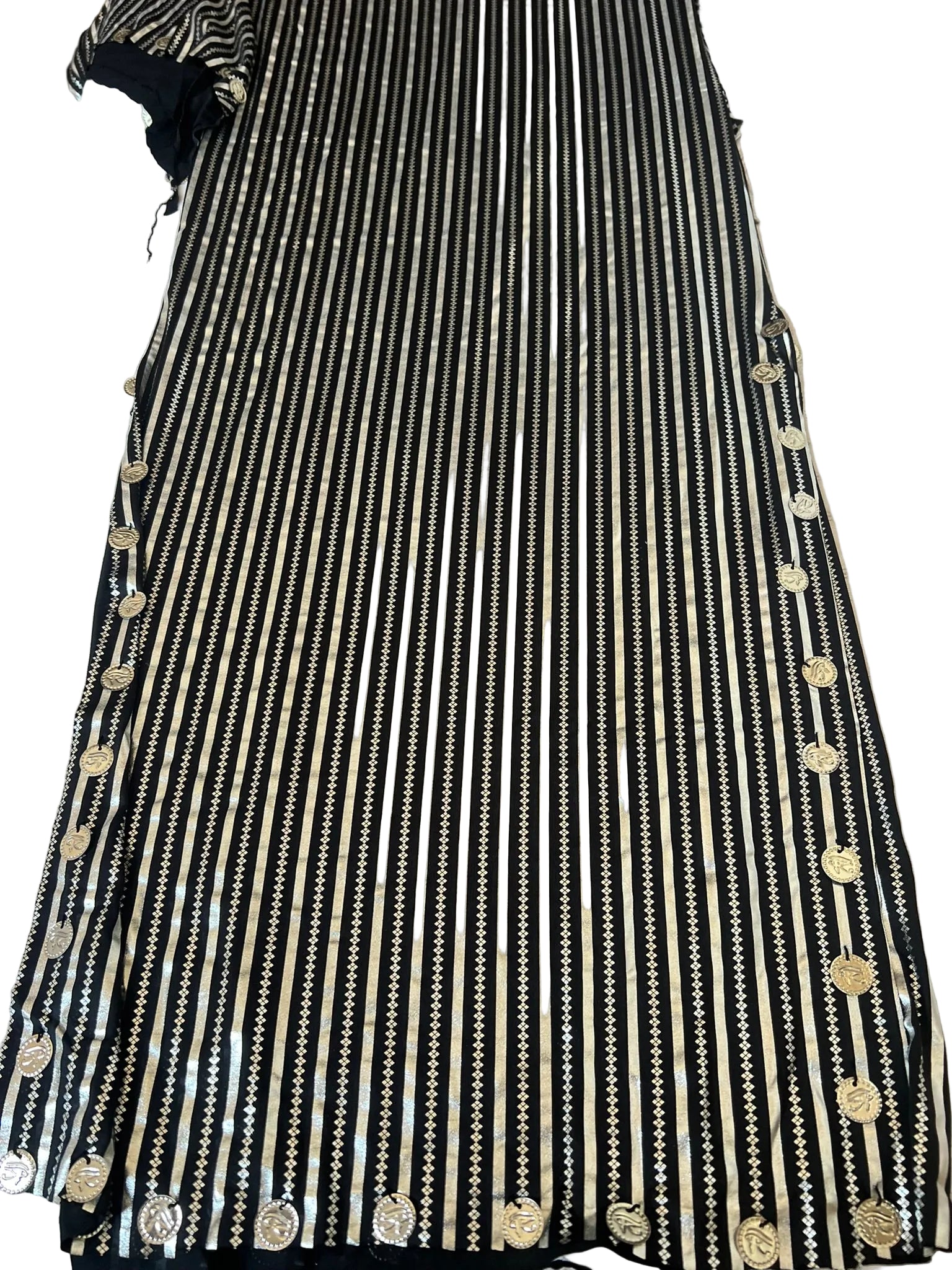 Black and white striped dress with gold buttons on a white background