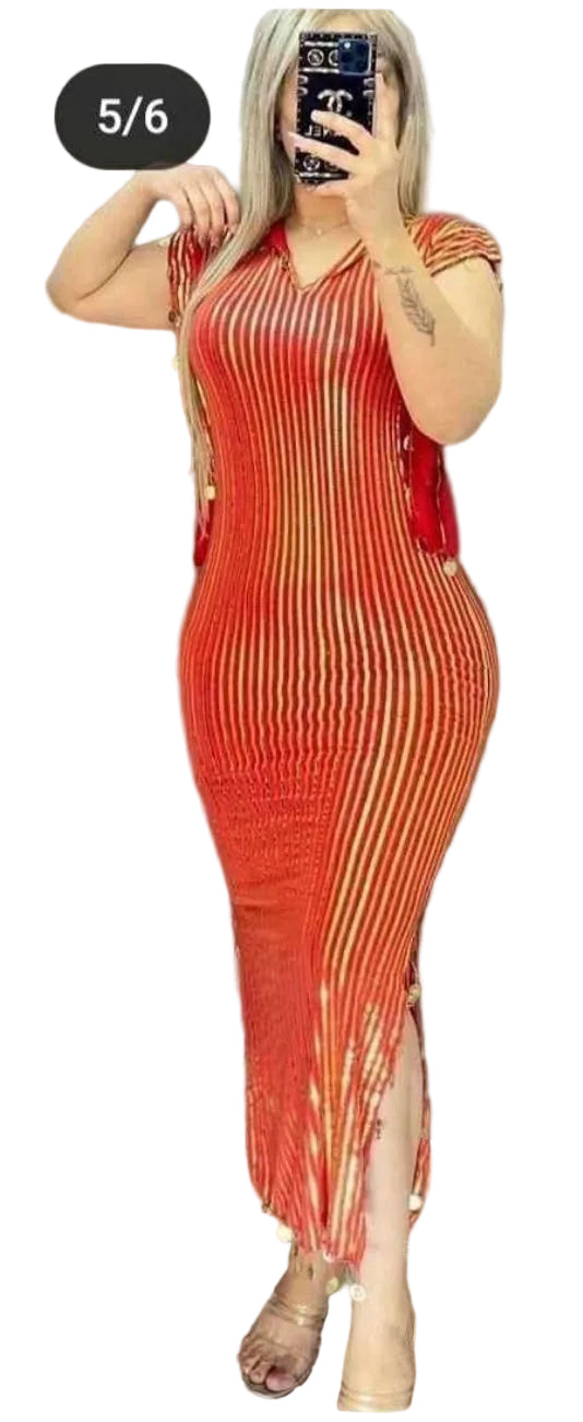Woman wearing a red ribbed dress with a slit, standing against a plain background.