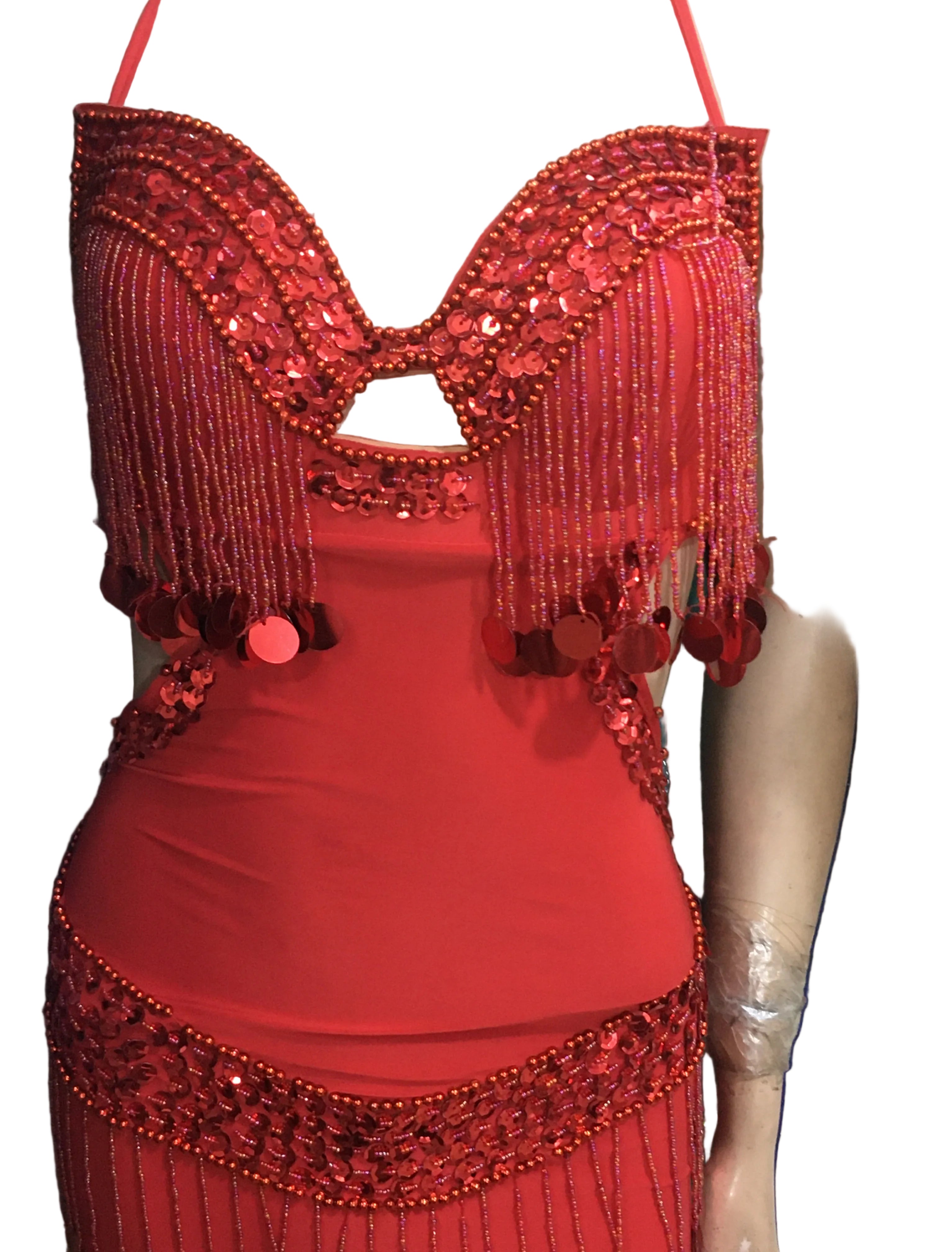 Red sequined top worn by a person, with a focus on the design and details.