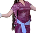 Woman wearing a maroon and white striped outfit with a white belt on a white background