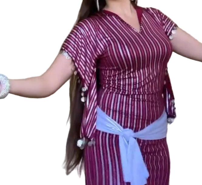 Woman wearing a maroon and white striped outfit with a white belt on a white background