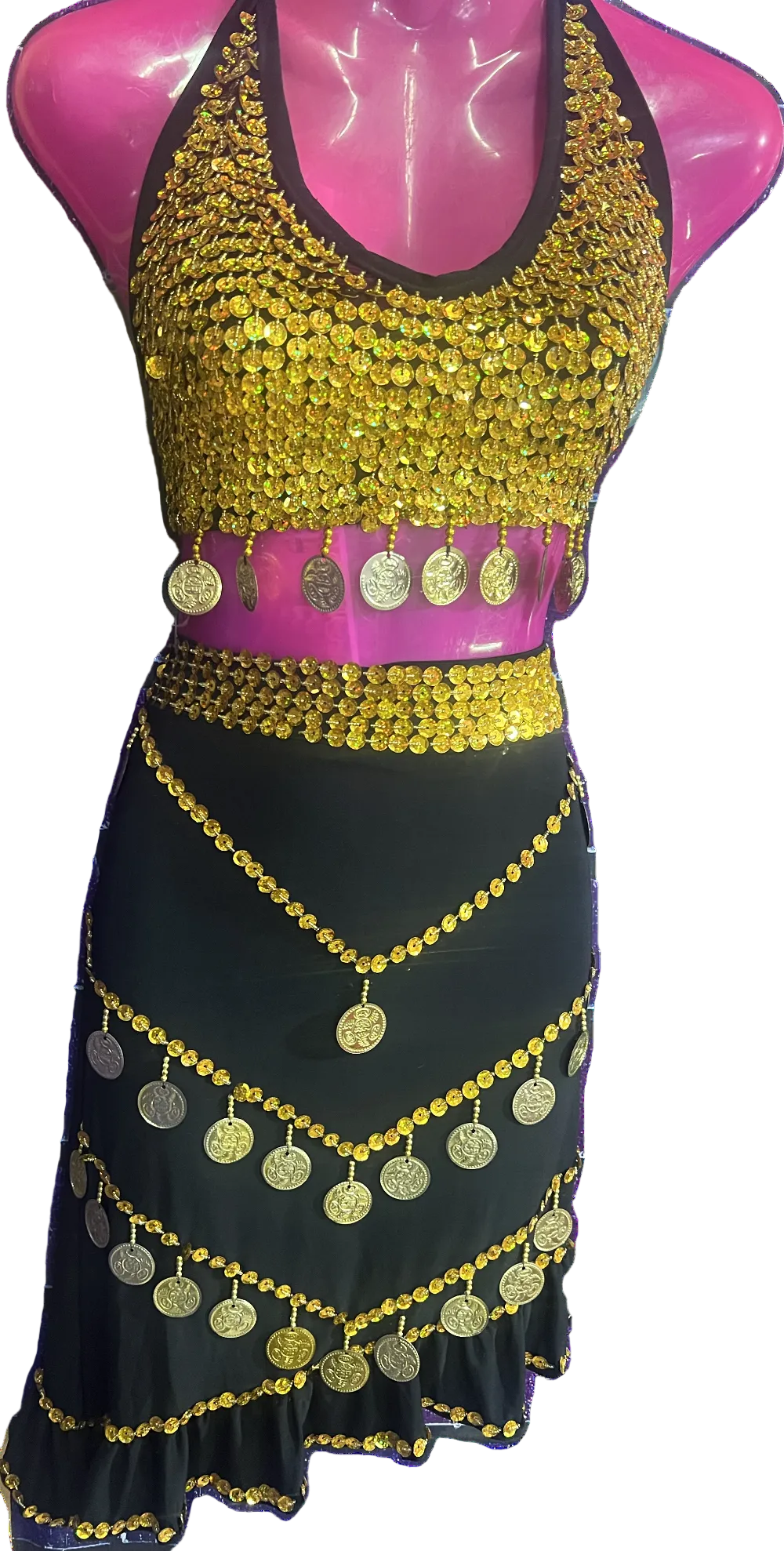A belly dance outfit featuring a beaded top with gold and pink colors and a matching skirt with gold embellishments, predominantly black in color.