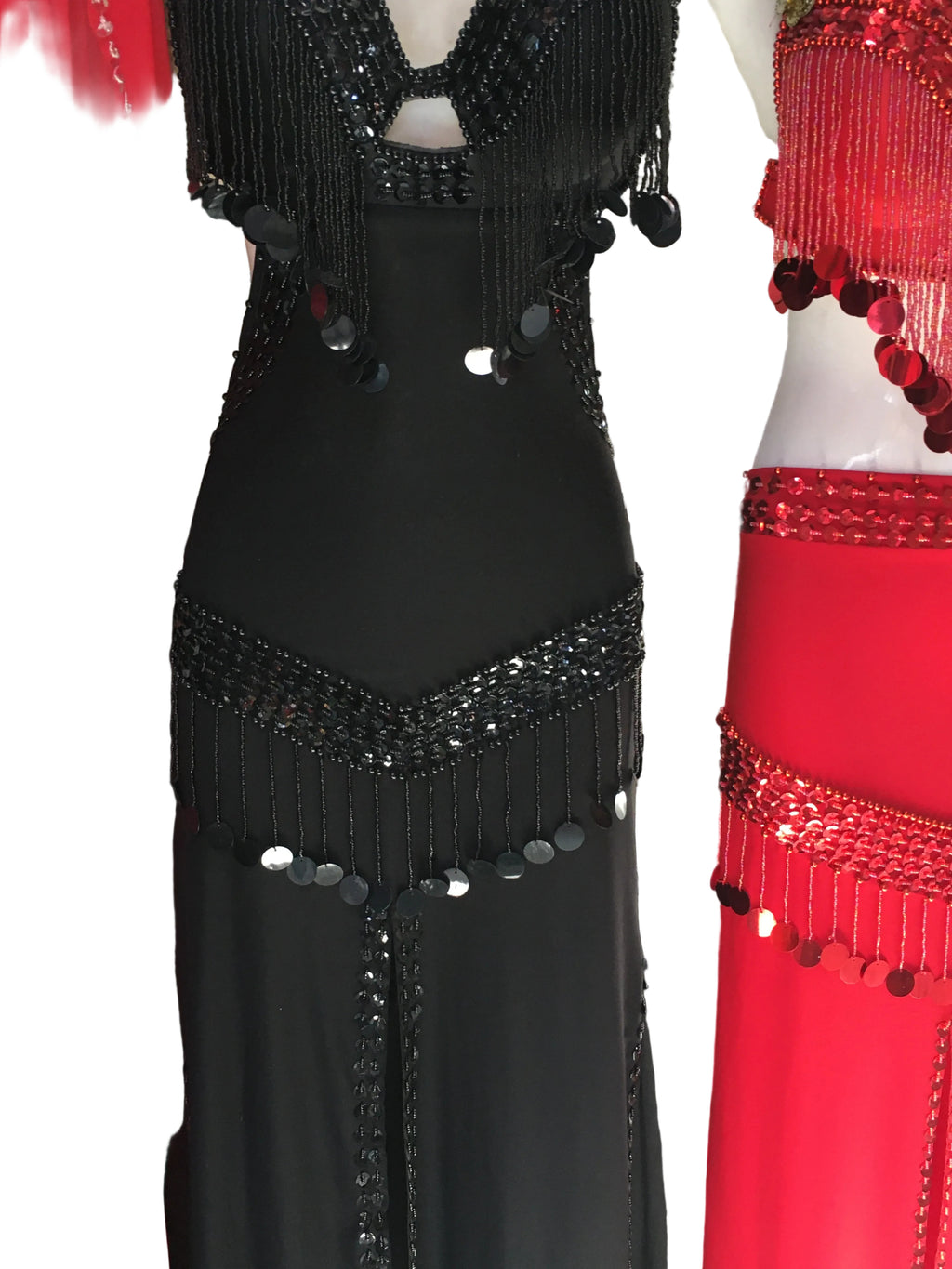 Black and red dresses with fringe and sequin details on mannequins.