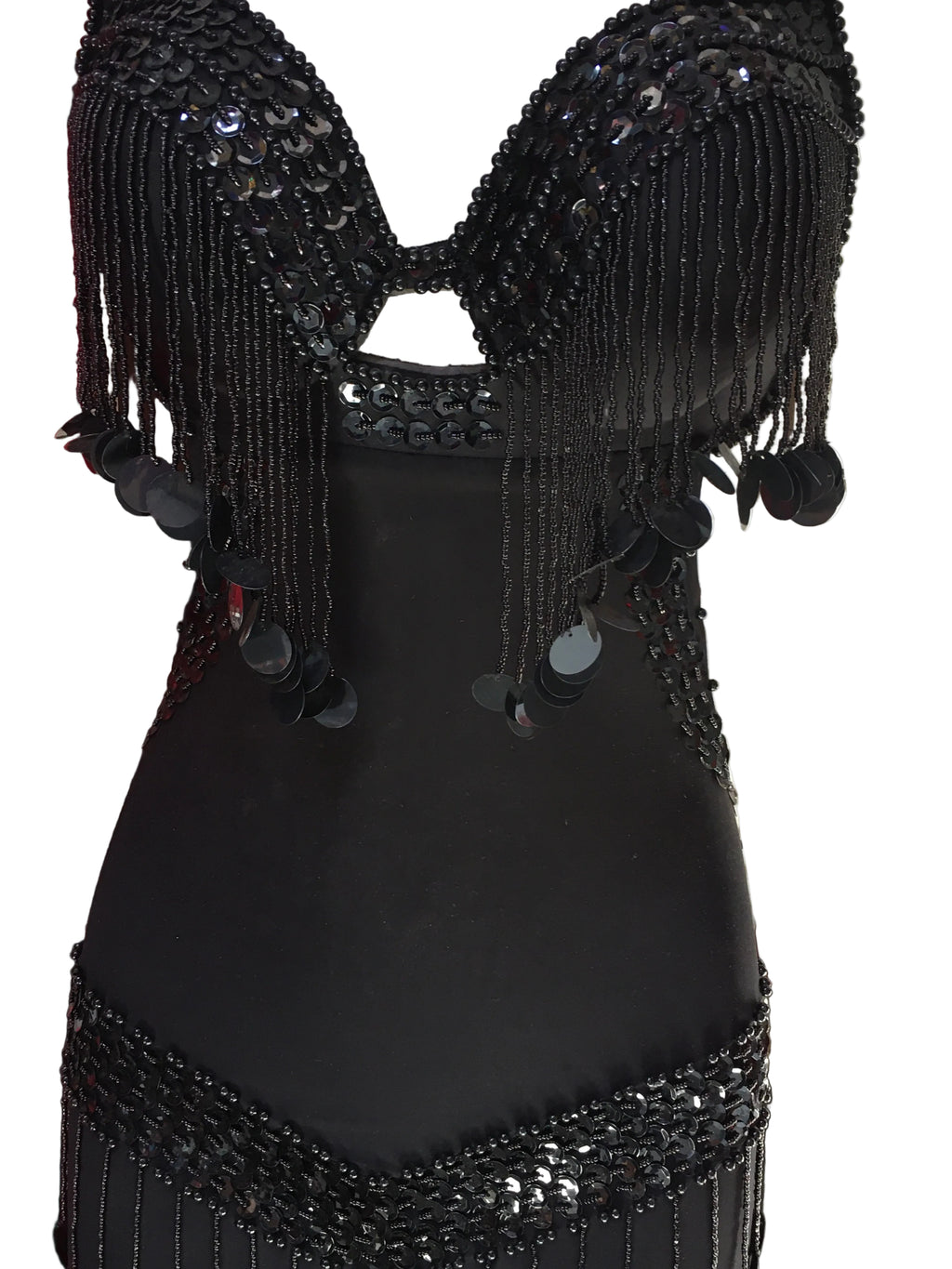 Black beaded top with fringe details on a white background
