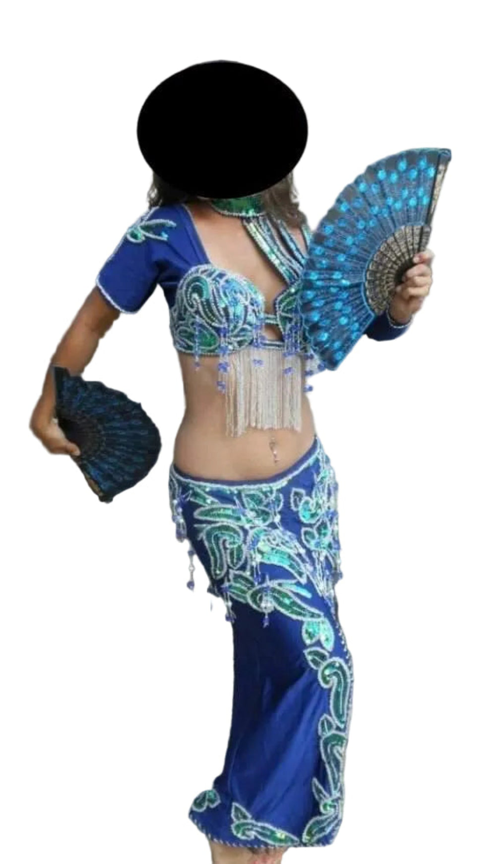 A woman in a traditional belly dance costume with a blue skirt and a matching top, holding a fan. The costume is adorned with glass beads and sequins.