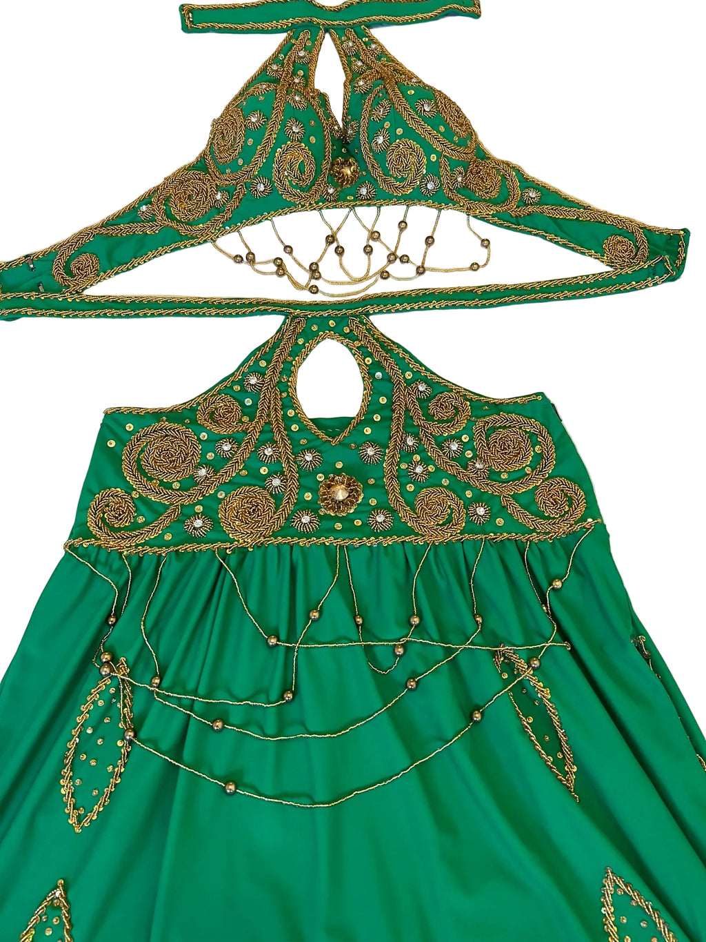 Green embroidered dress with matching headpiece on a white background