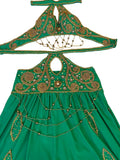 Green embroidered dress with matching headpiece on a white background