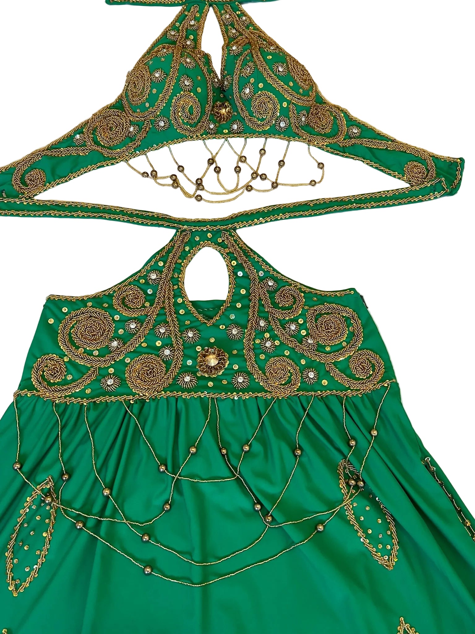 Green embroidered garment with gold detailing on a white background