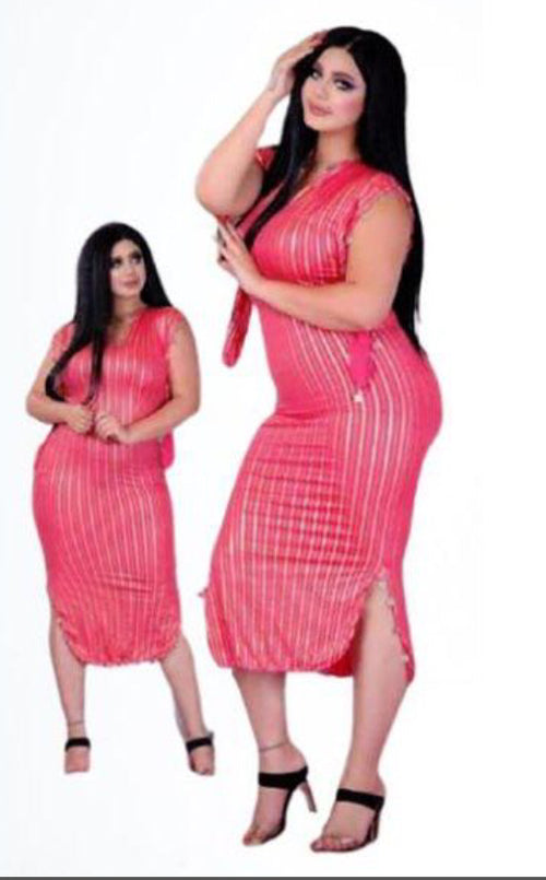 A person wearing a traditional Egyptian Saidi costume, featuring a black and blue striped pattern, commonly known as a Galabia, used for belly dance performances.