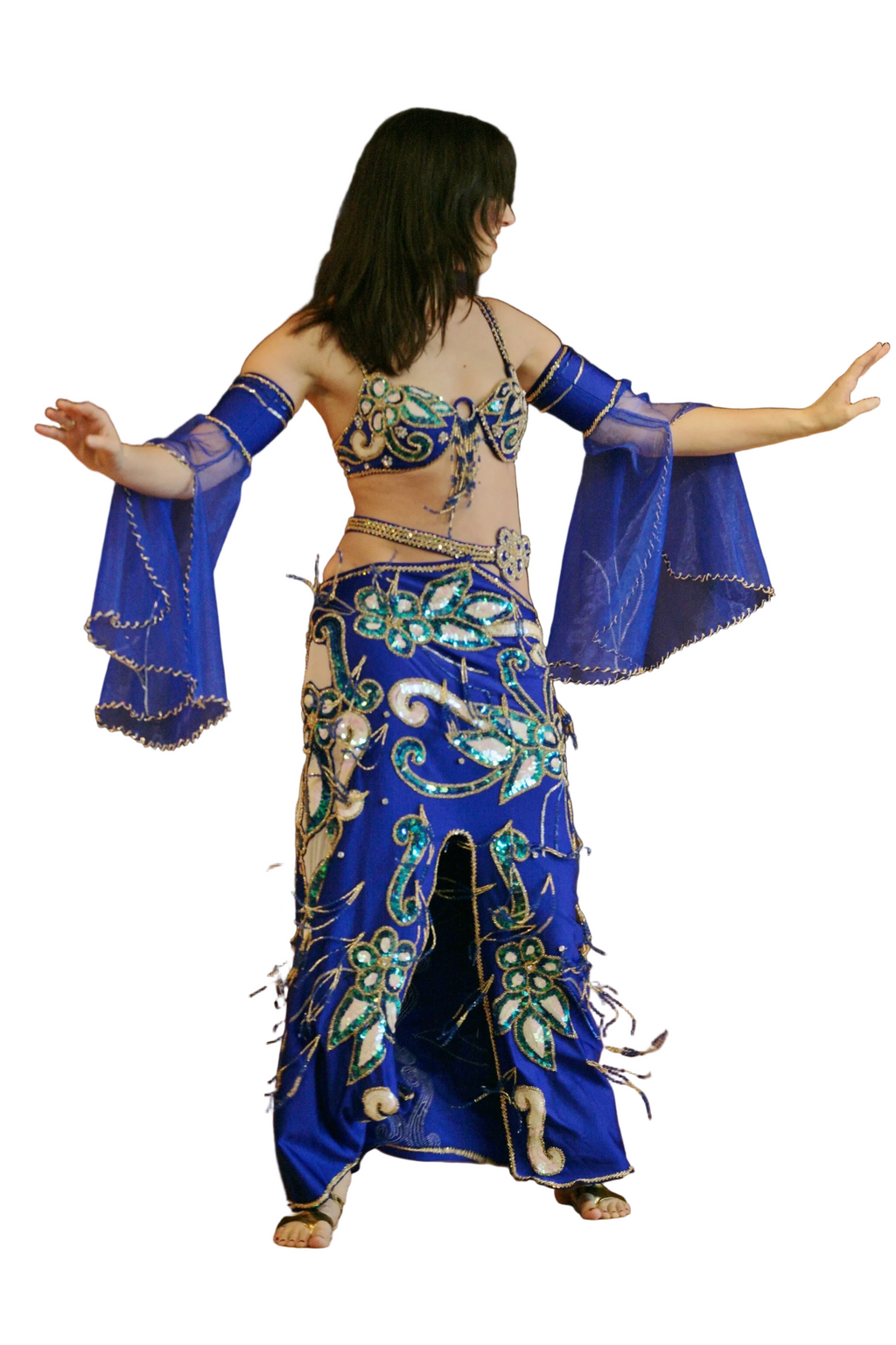 Woman wearing a blue and green belly dance costume on a white background