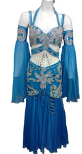A blue professional belly dance costume with intricate embellishments, including a bra, two-part skirt, sleeves, headband, and chiffon veil.