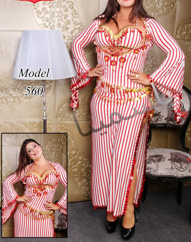 Woman wearing a red and white striped belly dance costume with gold accents on a white background
