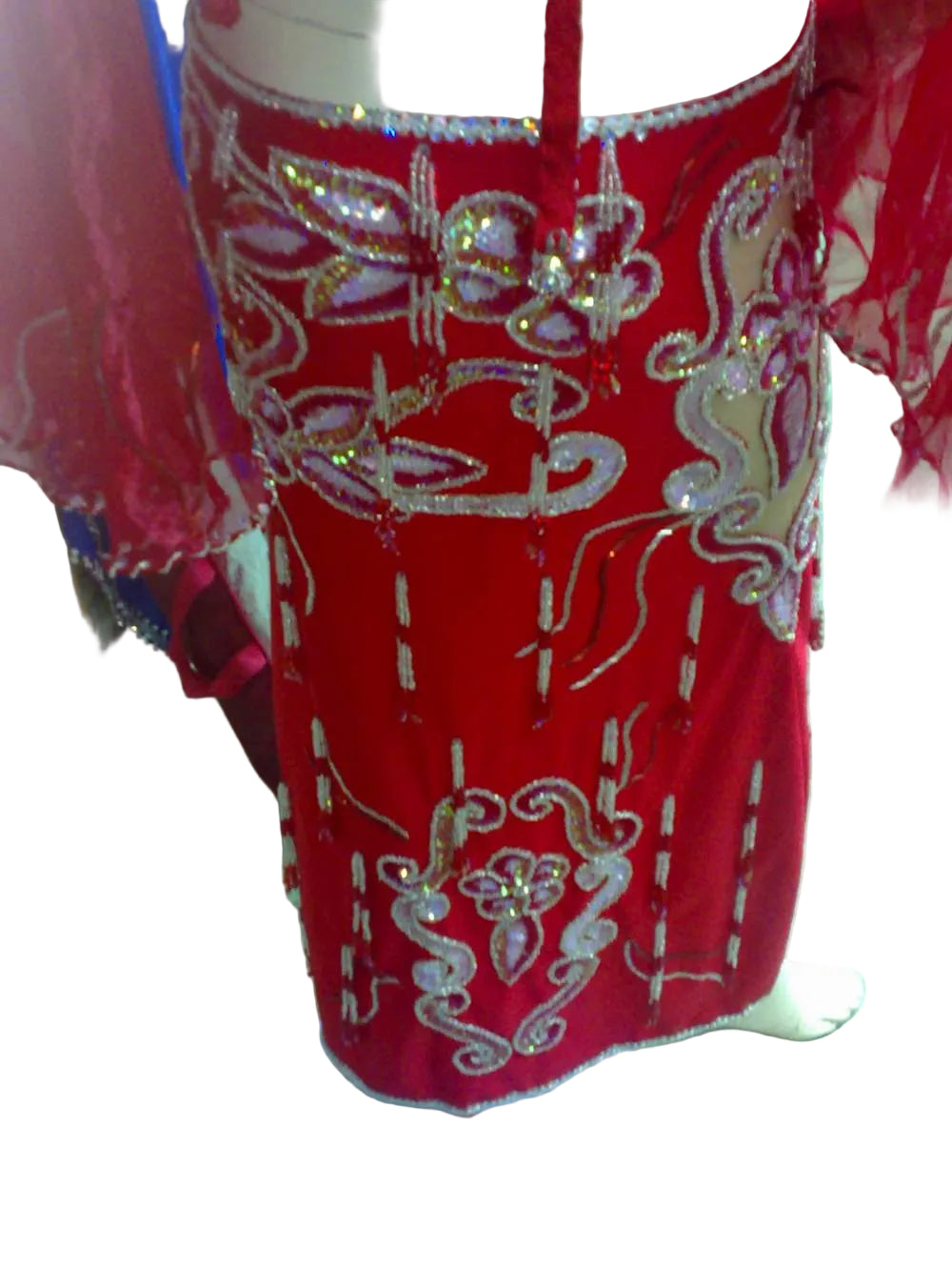 Red dress with white embroidery on a white background