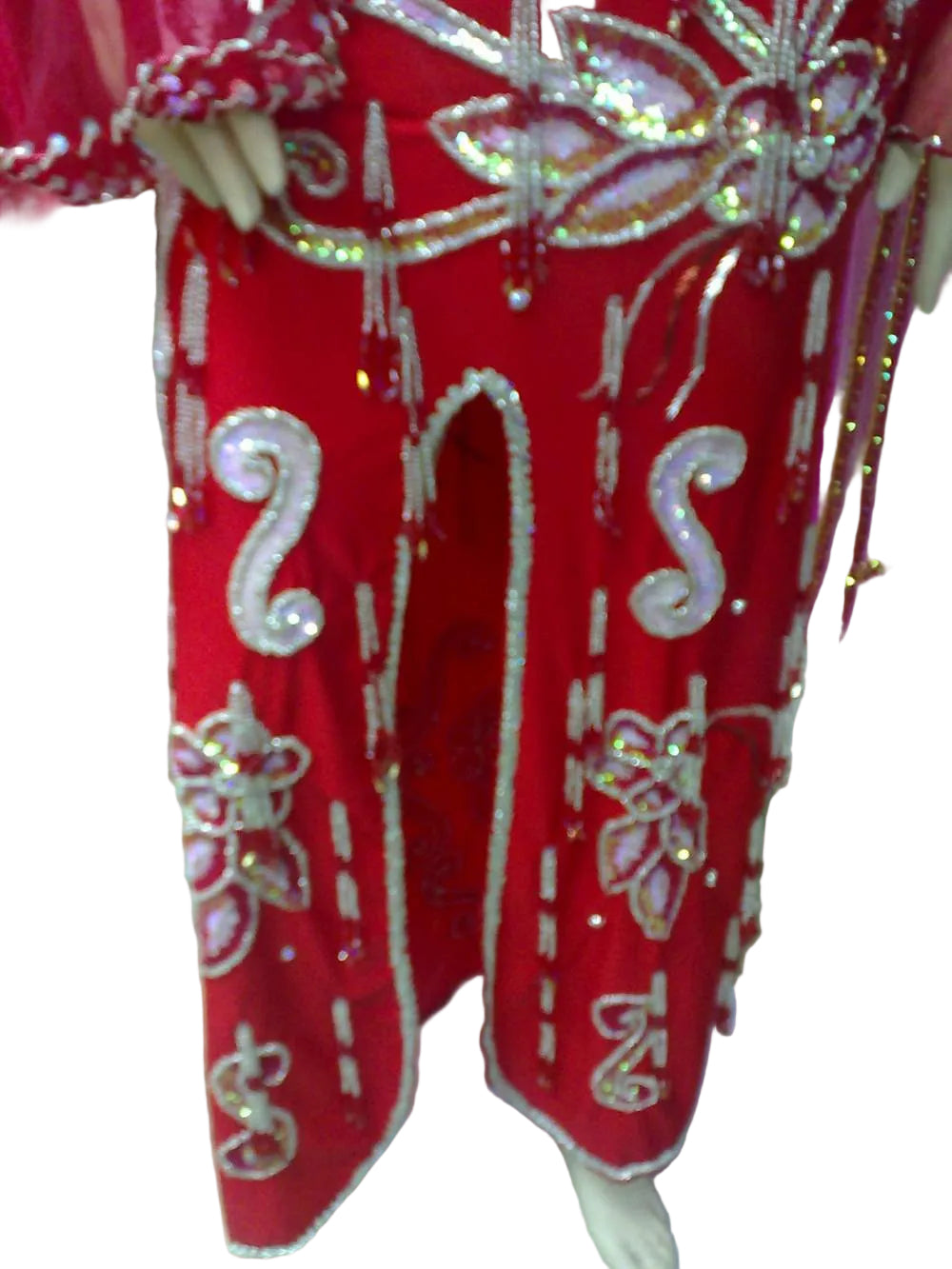 Red outfit with white and gold embellishments on a white background