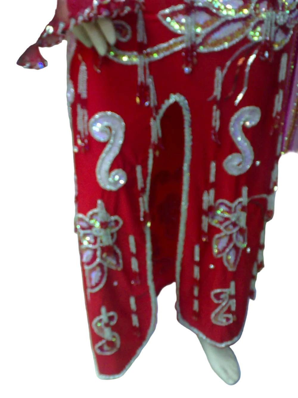 Red outfit with white embellishments on a white background