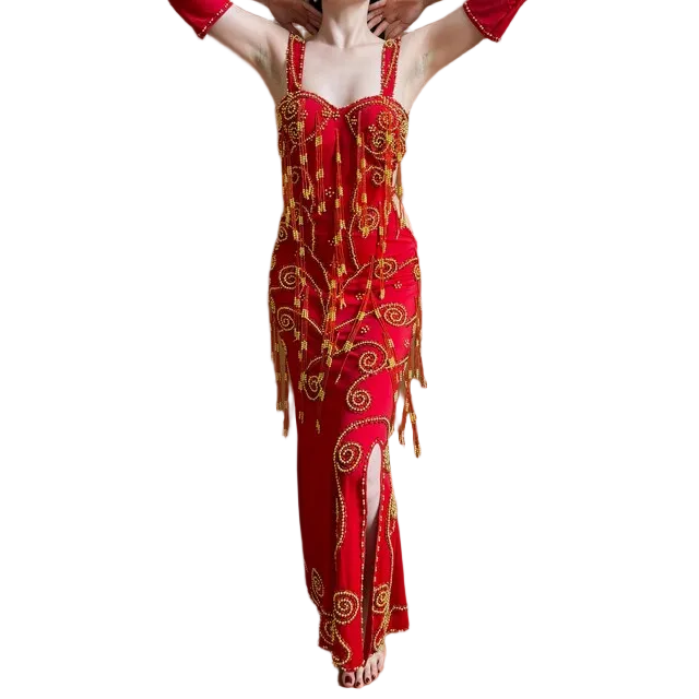 Red and gold patterned Belly Dance dress with cut-out design on a white background