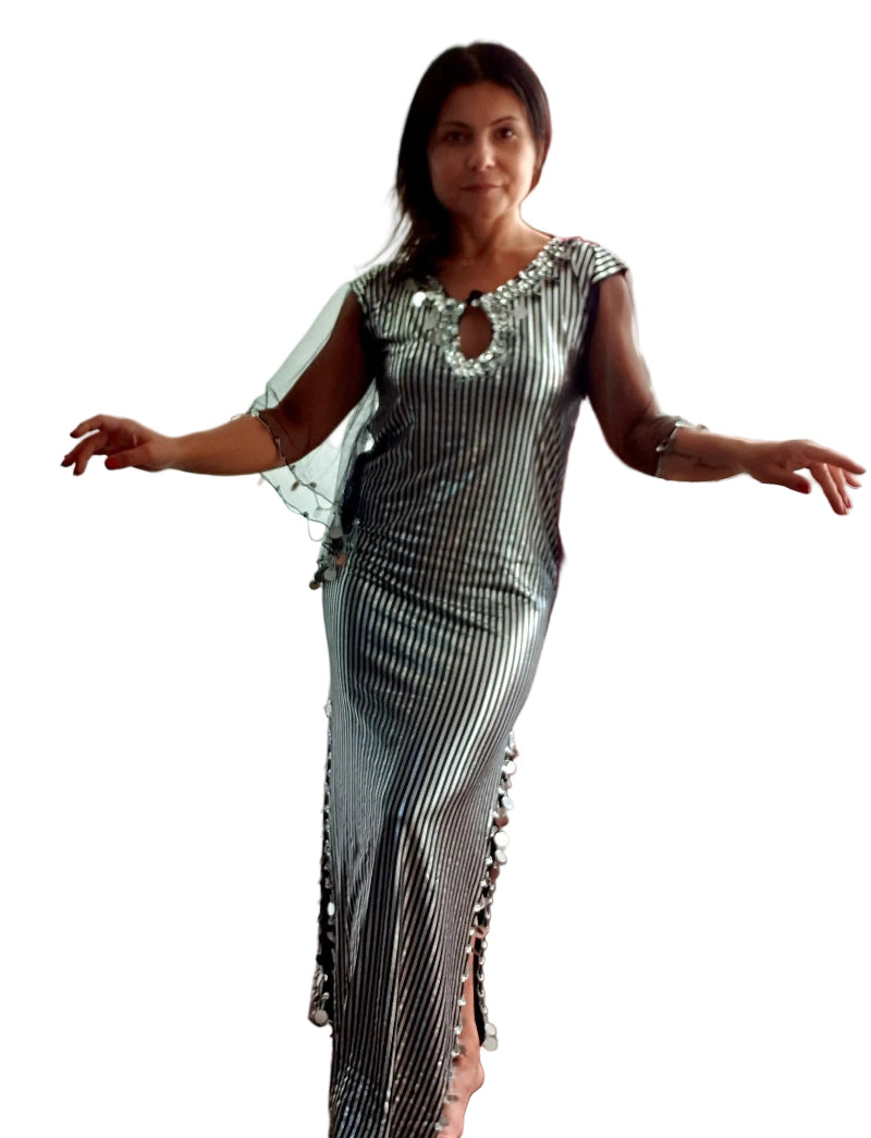 Woman wearing a black and white patterned dress on a white background