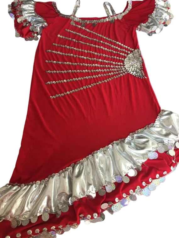 A red belly dance dress with silver embellishments and a central sequined yashmak design, displayed on a flat surface.