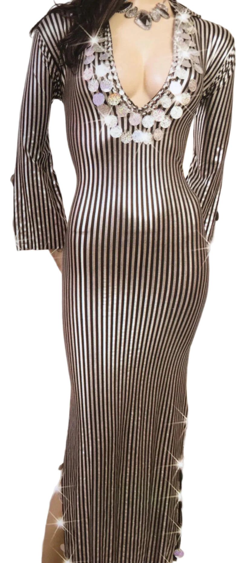 Striped dress with a decorative necklace on a neutral background