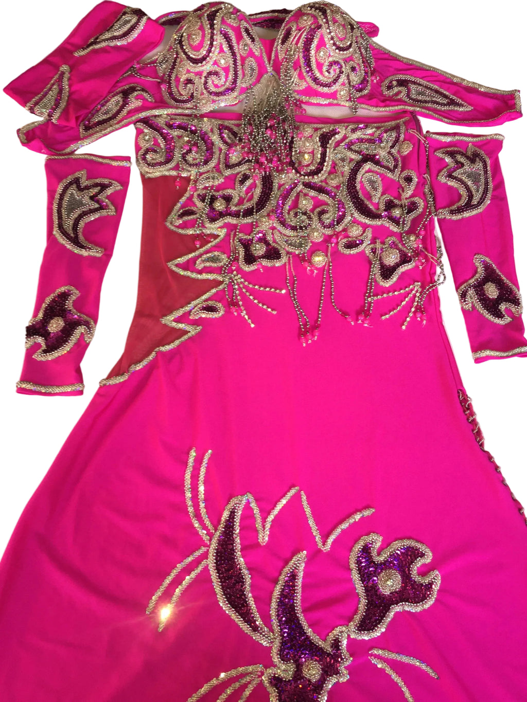 Pink outfit with intricate gold and purple embellishments on a white background