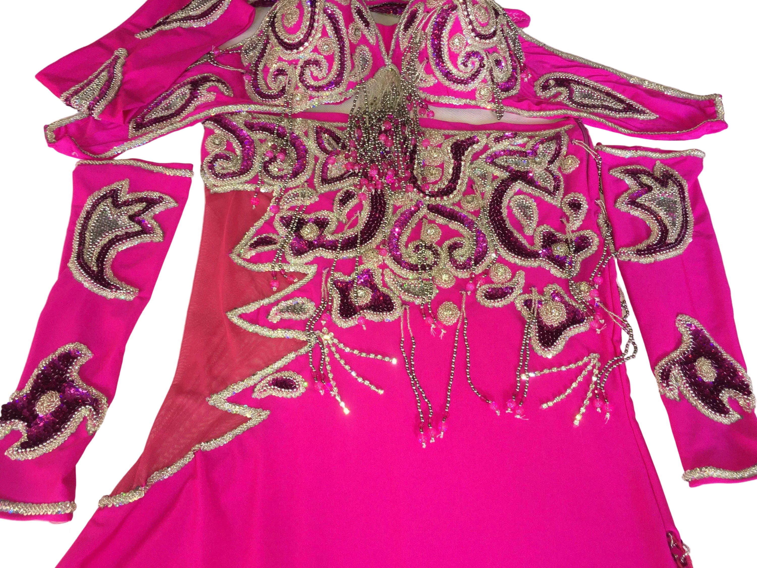 A professional belly dance costume set in pink, including a bra, skirt, sleeves, and headband, adorned with handmade embroidery, beads, sequins, and rhinestone straps.