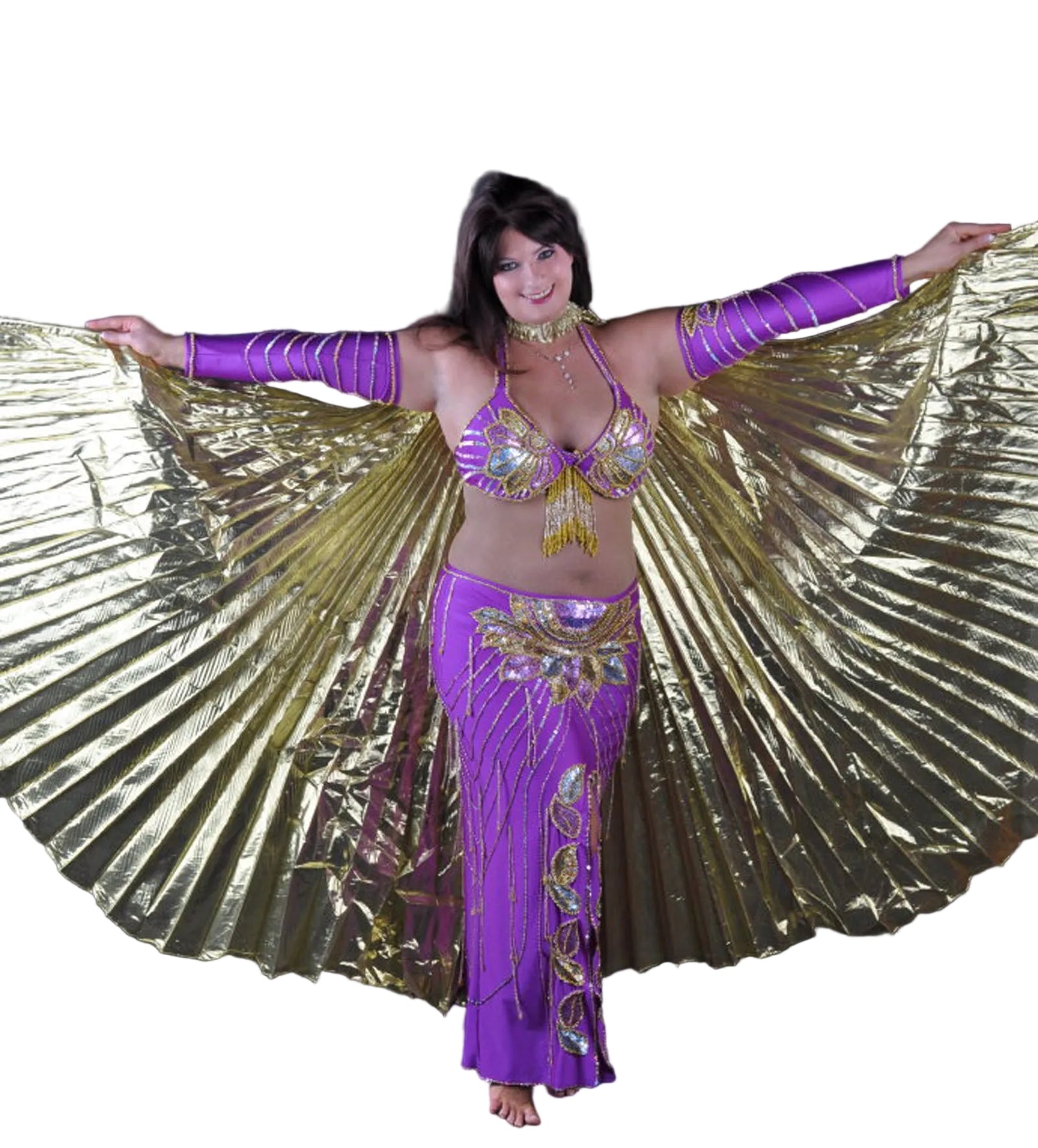 A woman performing a dance, wearing a purple and gold belly dance costume with large feathered skirt, posing against a black background.