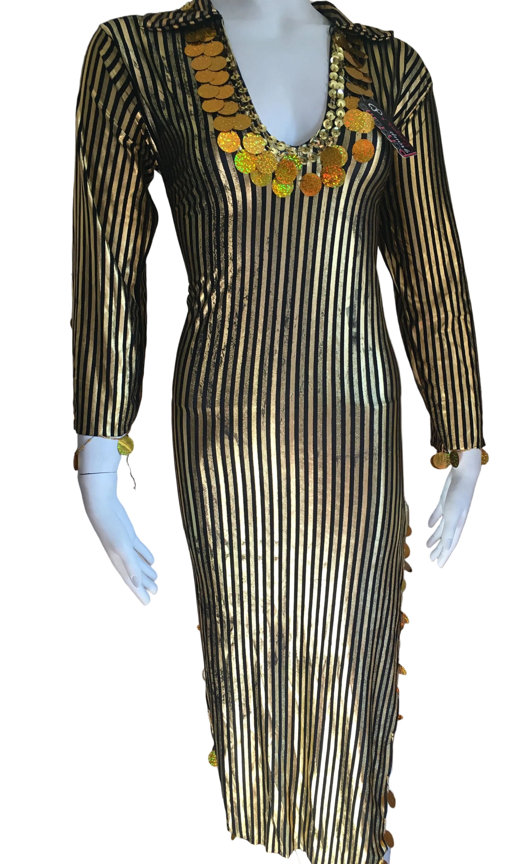 Mannequin wearing a black and gold dress with decorative elements, branded 'Luxor Bazar'.