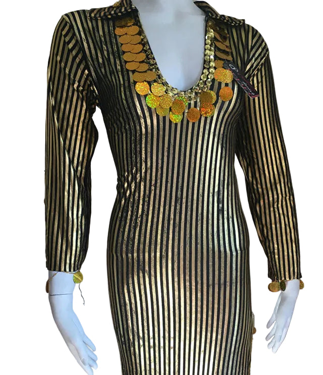 Mannequin wearing a black and gold striped dress with decorative elements on a plain background
