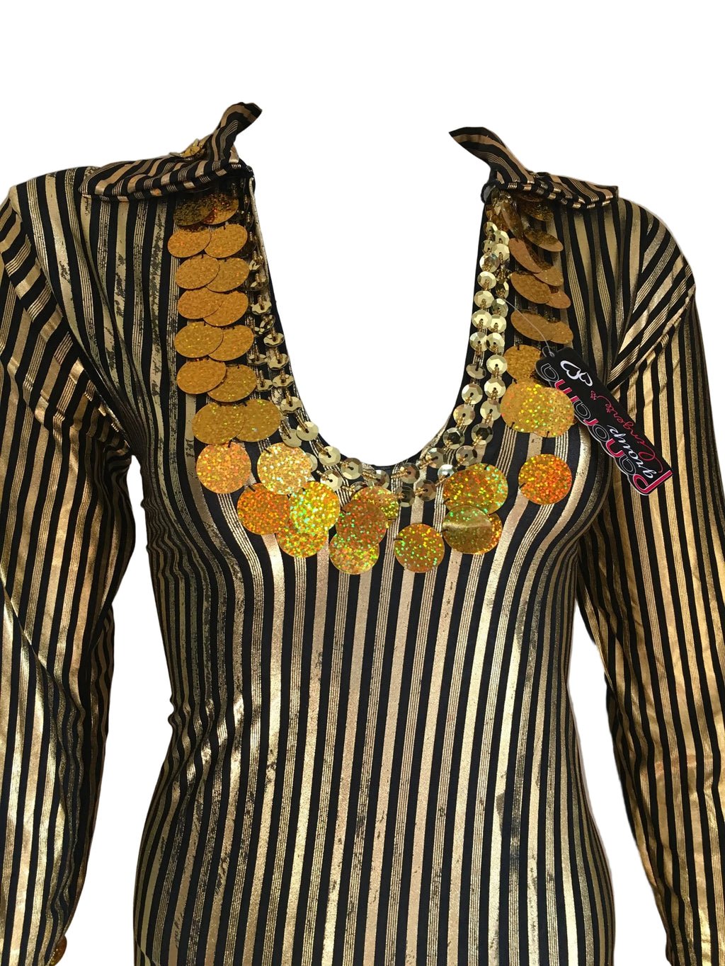 Mannequin wearing a black and gold striped outfit with a decorative necklace on a plain background