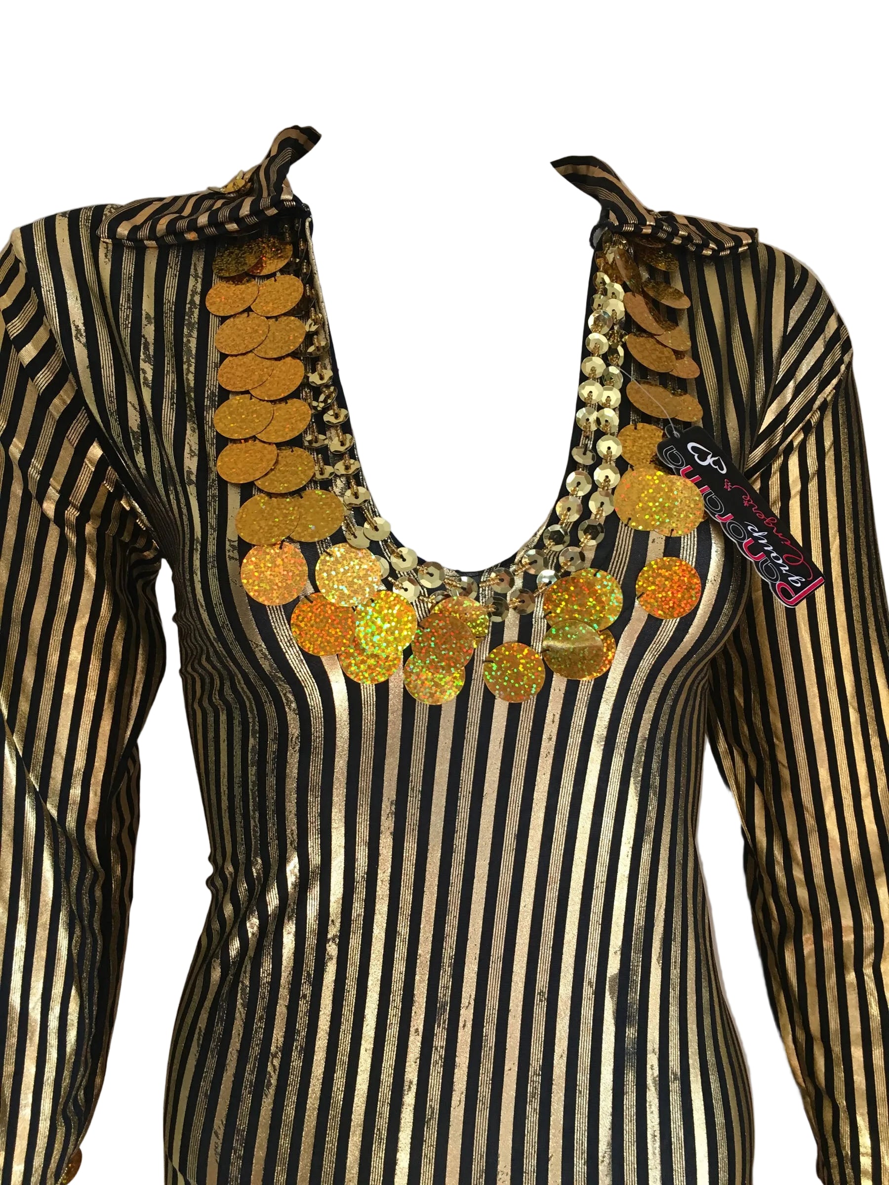Mannequin wearing a black and gold striped outfit with a decorative necklace on a plain background