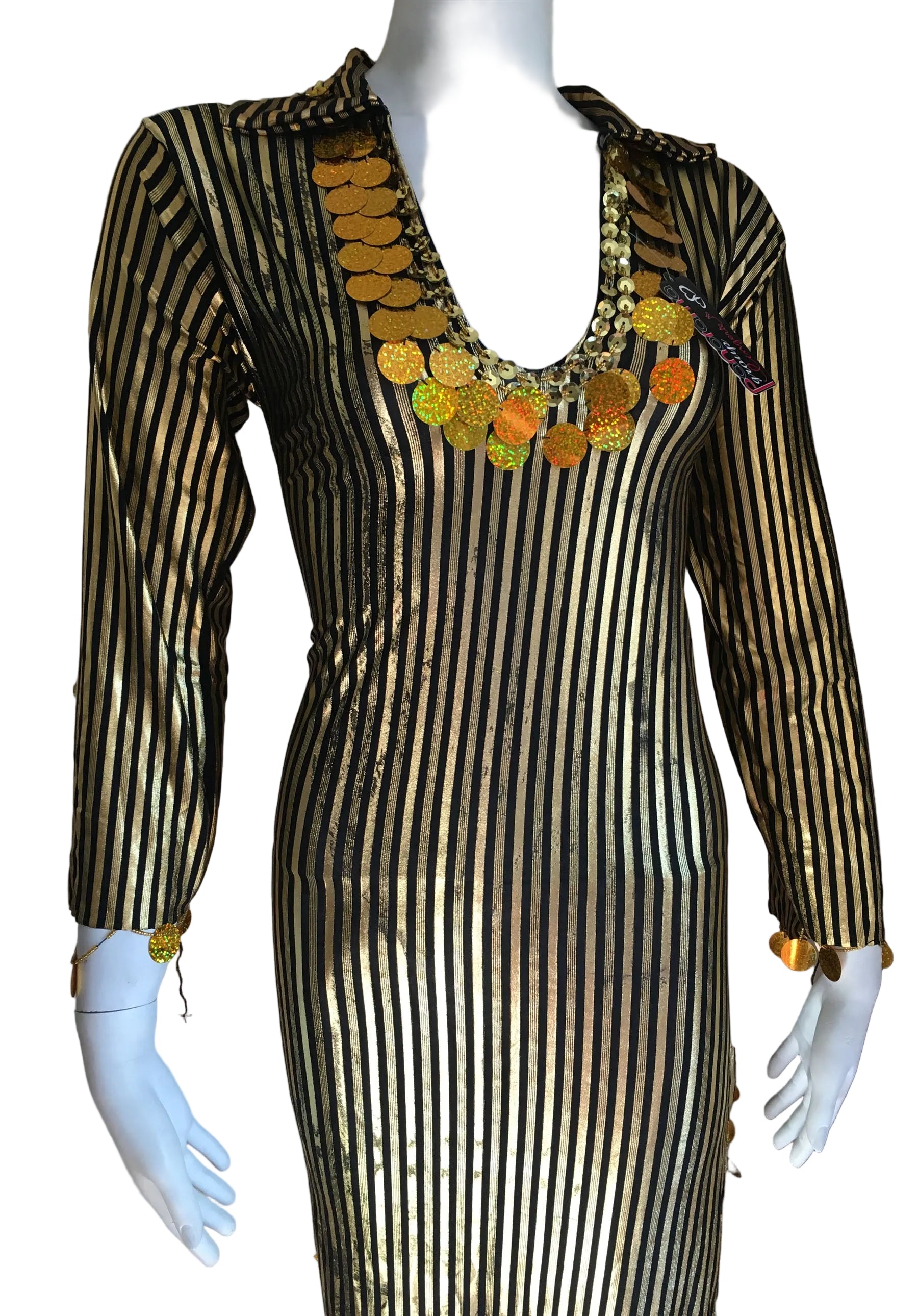 Mannequin wearing a black and gold striped dress with floral embellishments.