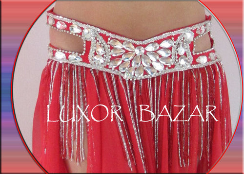 A professional belly dance costume featuring a red double-layer chiffon skirt with a belt, attached sleeves, and decorated with clear glass stones, beads, and sequins.