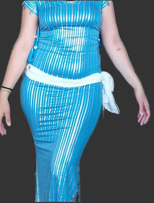 Person wearing a blue dress with a white belt in an indoor setting