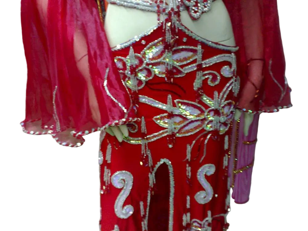 Red costume with gold and silver embellishments on a white background